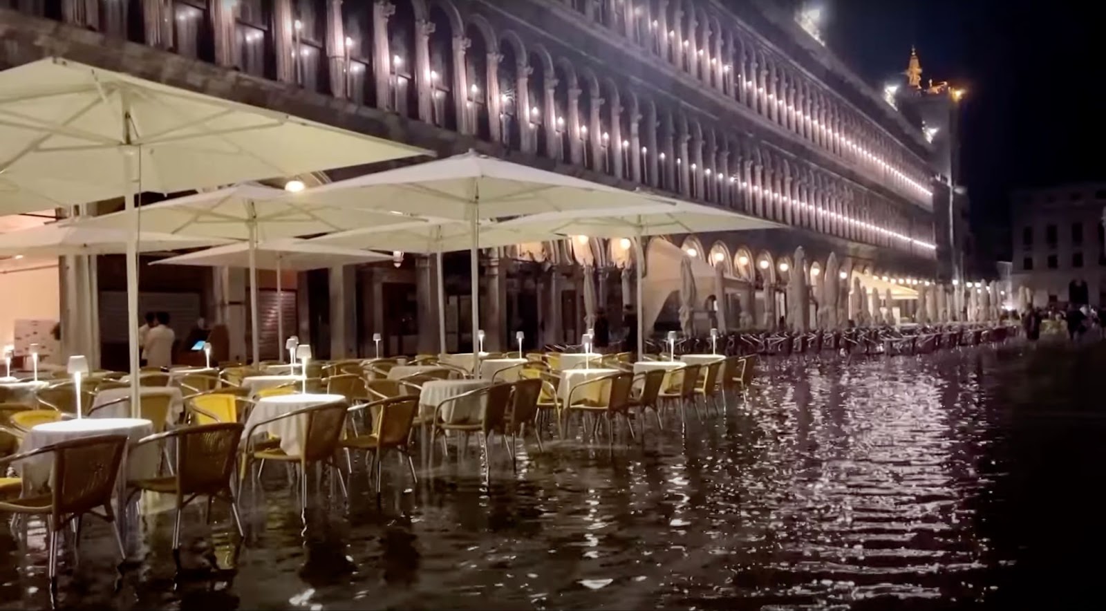Flooded Piazza San Marco, nearby tables with a canopy