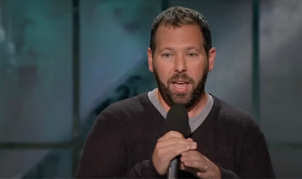 Bert Kreischer performs with a microphone