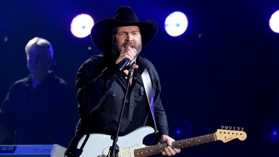 Garth Brooks performing on stage