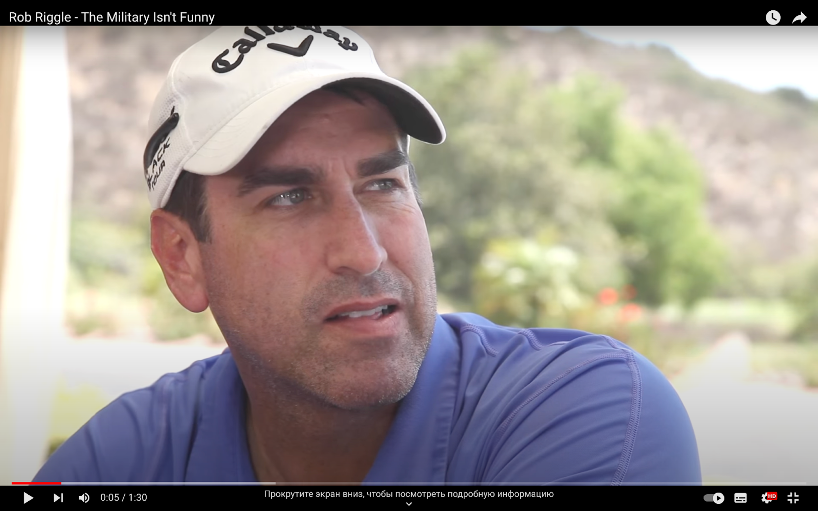 Rob Riggle wearing a cap