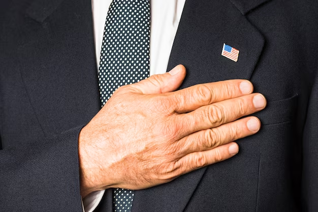A man's hand rests on his heart